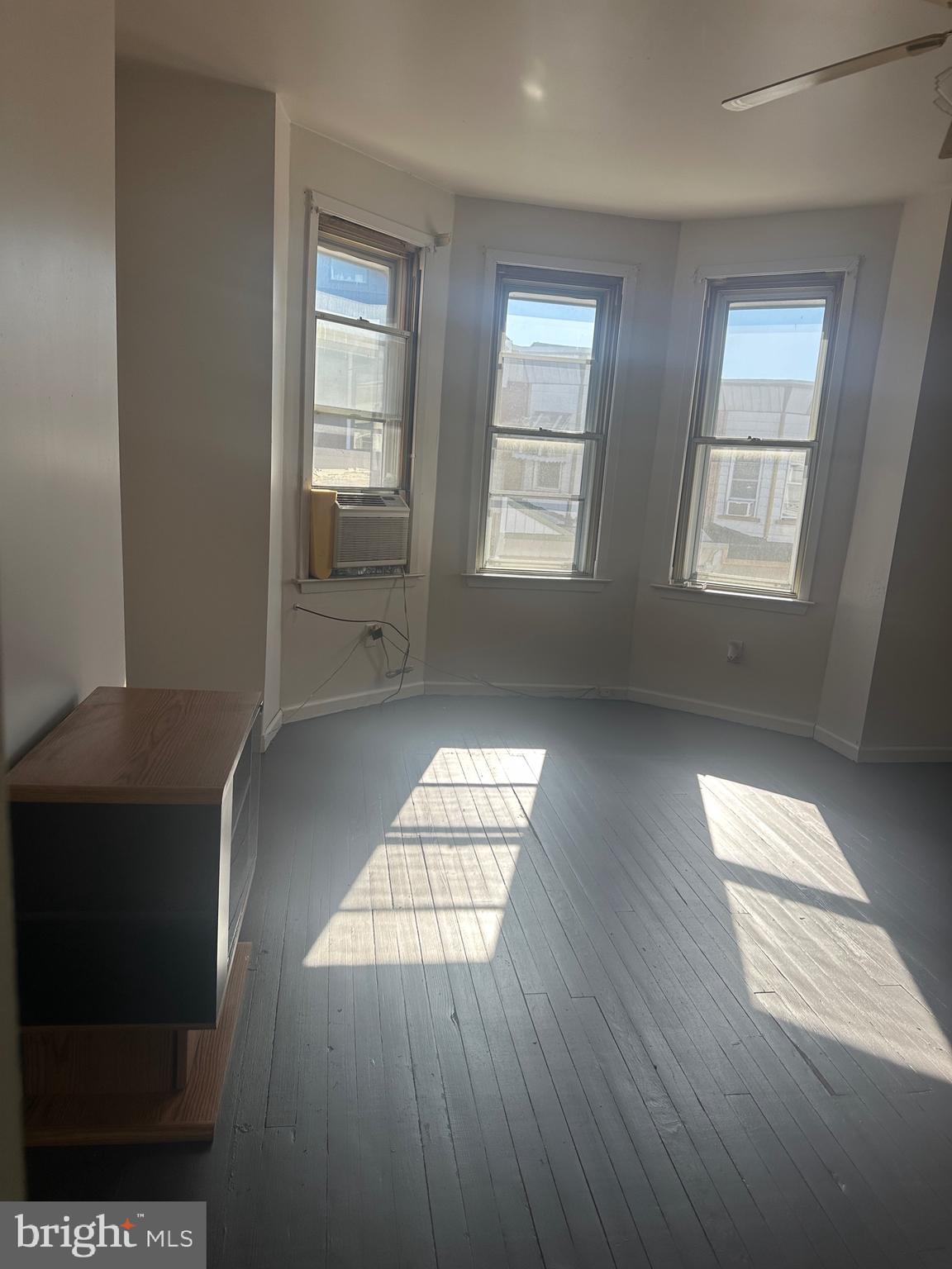 5403 Webster Street Philadelphia, PA 19143 - Photo 18 of 25 an empty room with wooden floor and windows