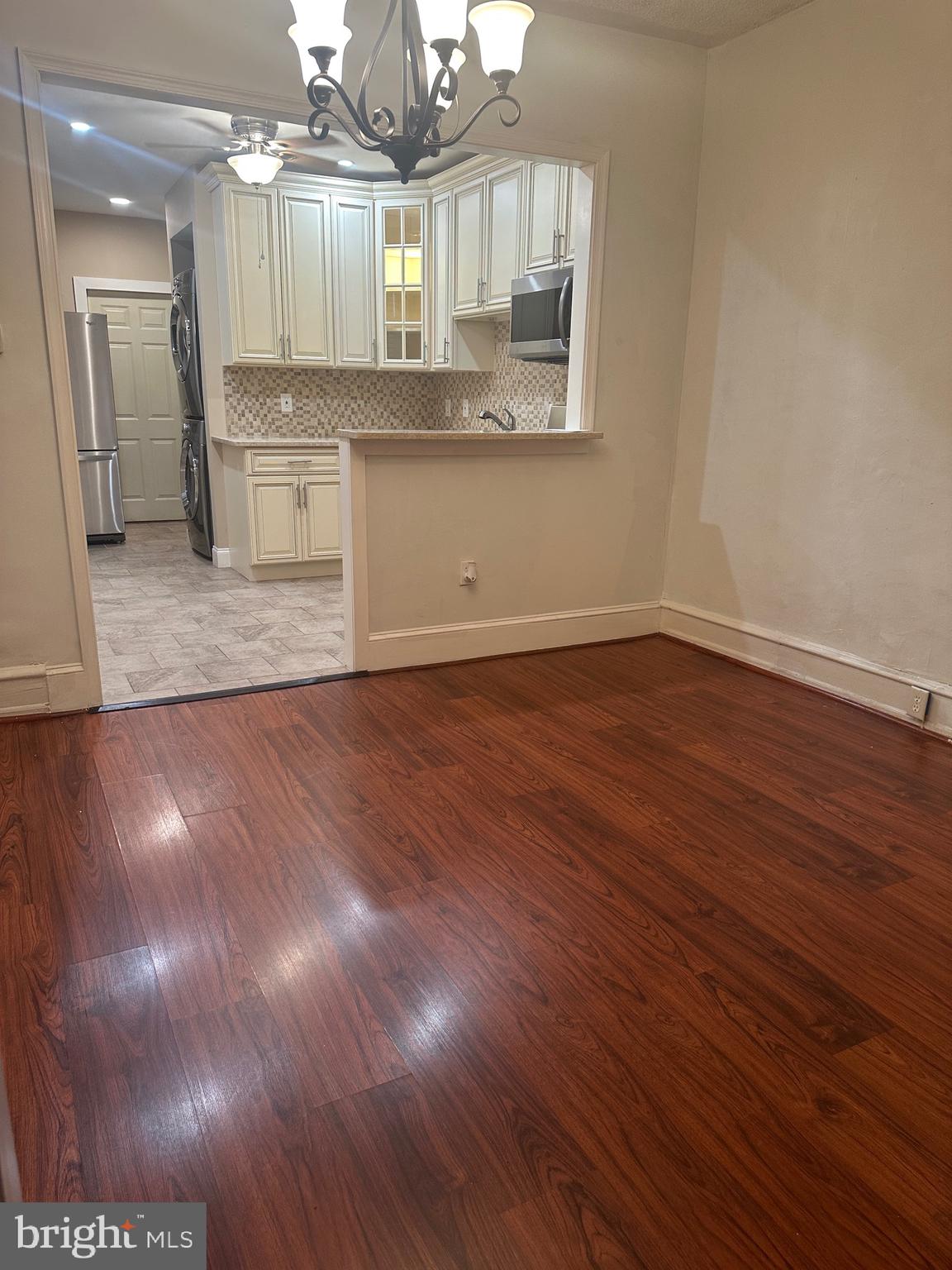 5403 Webster Street Philadelphia, PA 19143 - Photo 7 of 25 a view of a kitchen with a sink and wooden floor