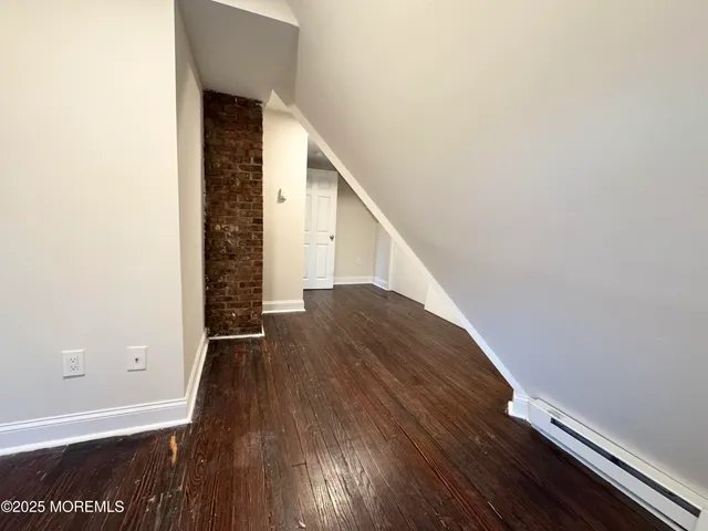 a view of entryway with wooden floor