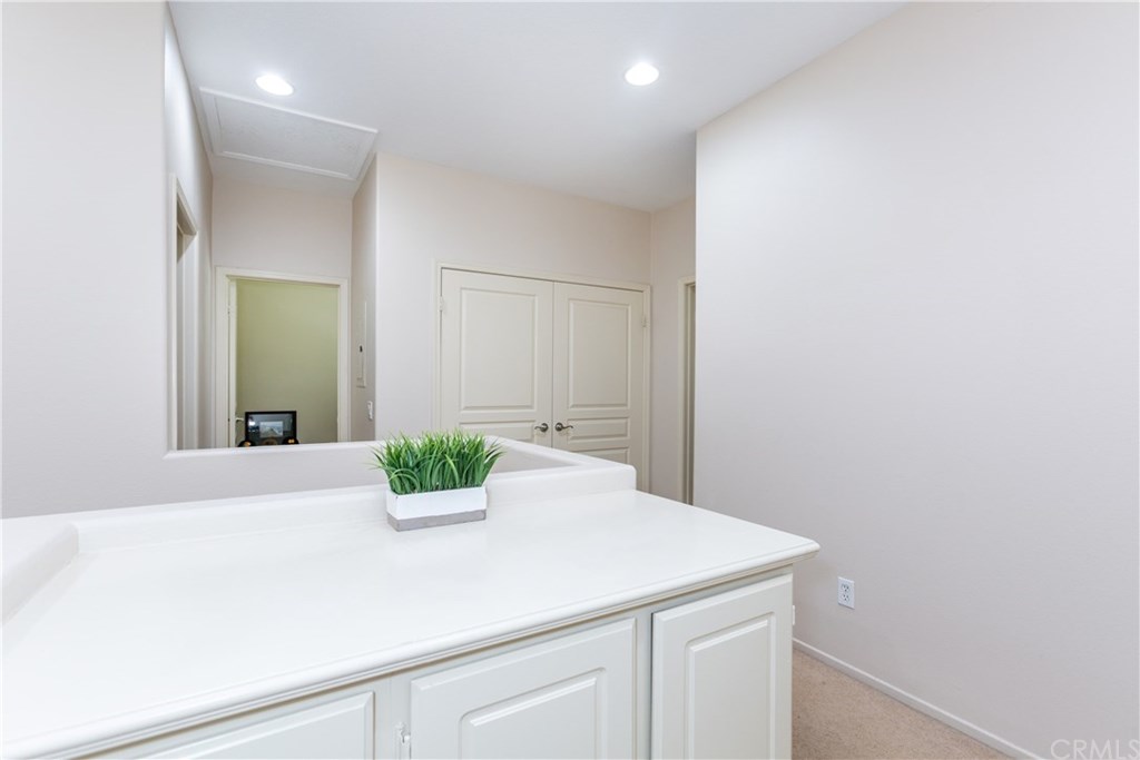 24002 Cornelia Place Valencia, CA 91354 - Photo 14 of 28 upstairs hallway - washer /dryer space behind double doors.