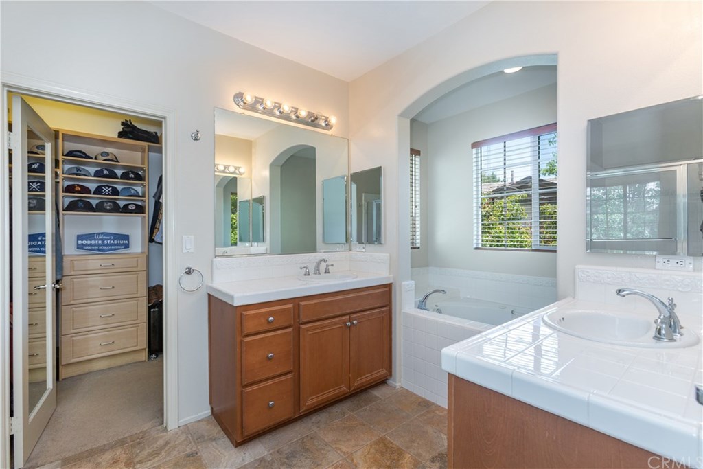 24002 Cornelia Place Valencia, CA 91354 - Photo 22 of 28 Master bathroom w/ 2 vanities and walk-in closet