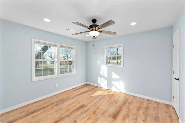 a view of an empty room and closet area