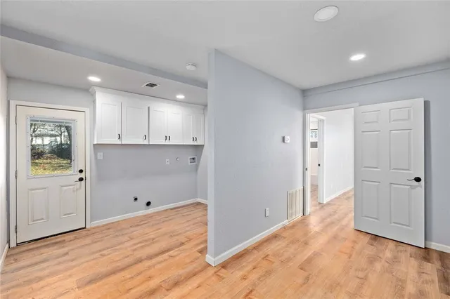 a view of an empty room with a window