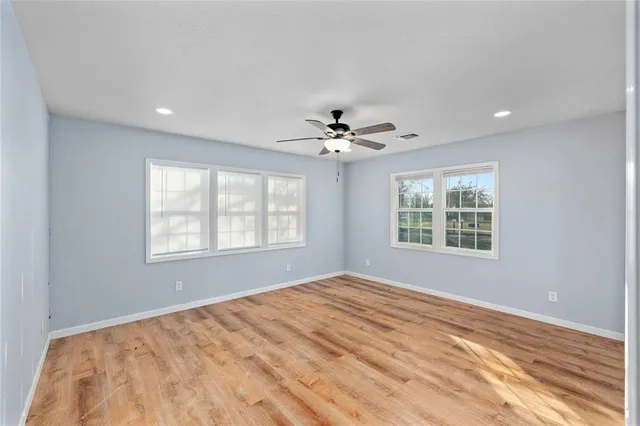 a view of a room with a ceiling fan