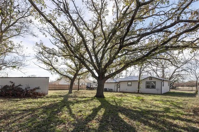 a house with trees in front of it
