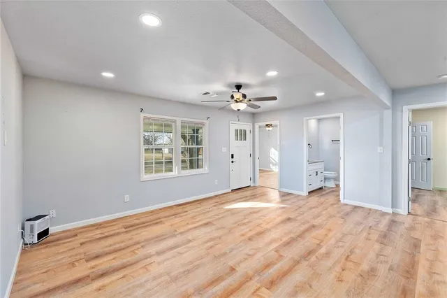 a view of an empty room with a window