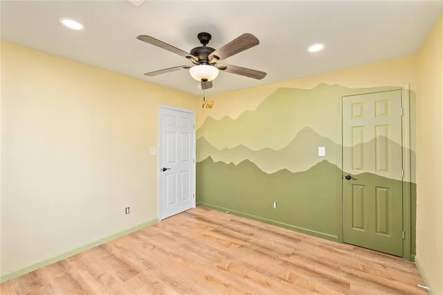 a bathroom with a sink toilet vanity and shower