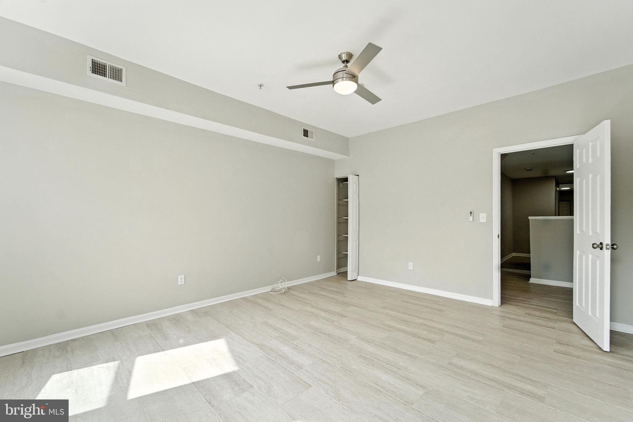 2100 Homewood Avenue, Unit 2 Baltimore, MD 21218 - Photo 4 of 10 a view of empty room with wooden floor