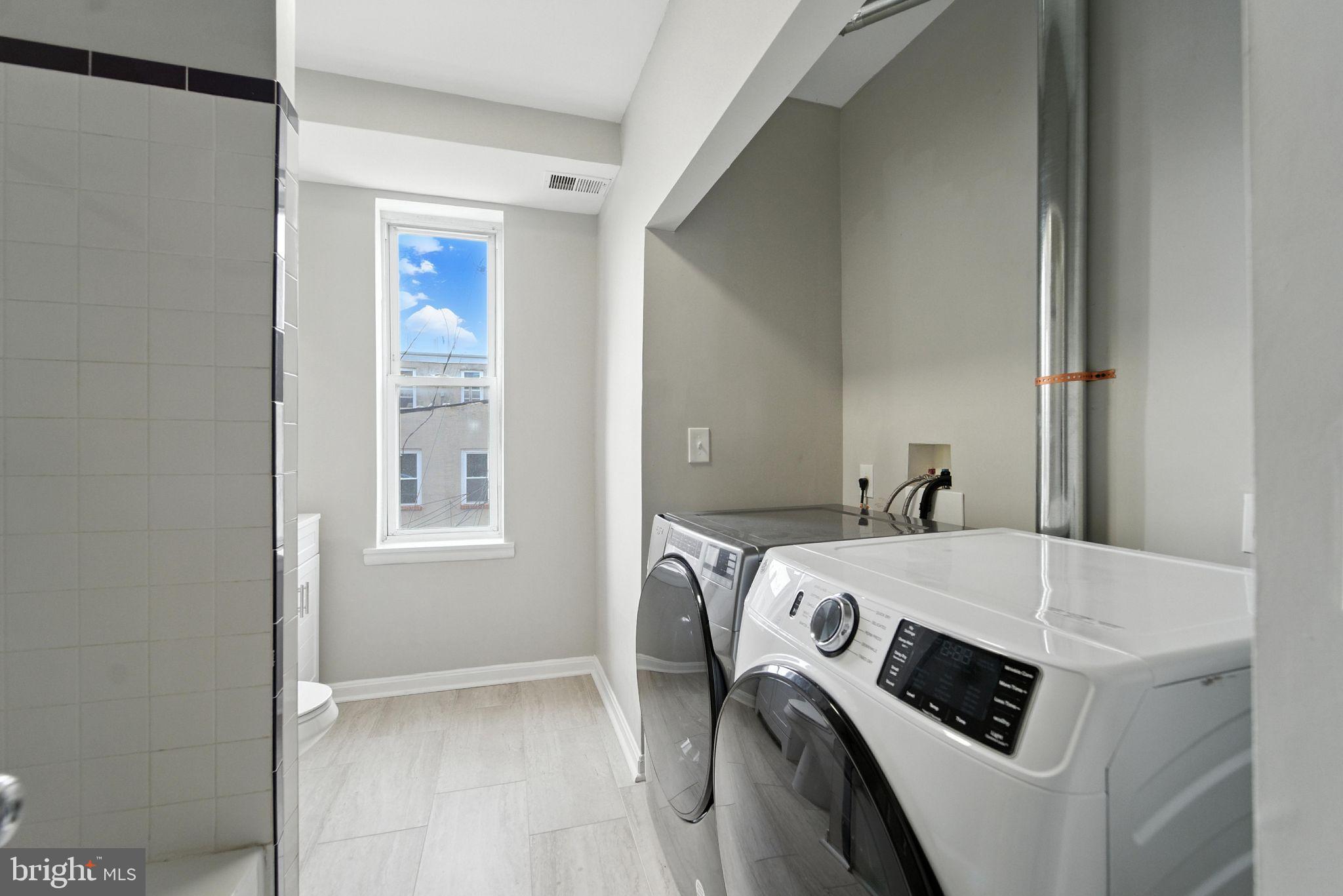 2100 Homewood Avenue, Unit 2 Baltimore, MD 21218 - Photo 7 of 10 a utility room with dryer and washer