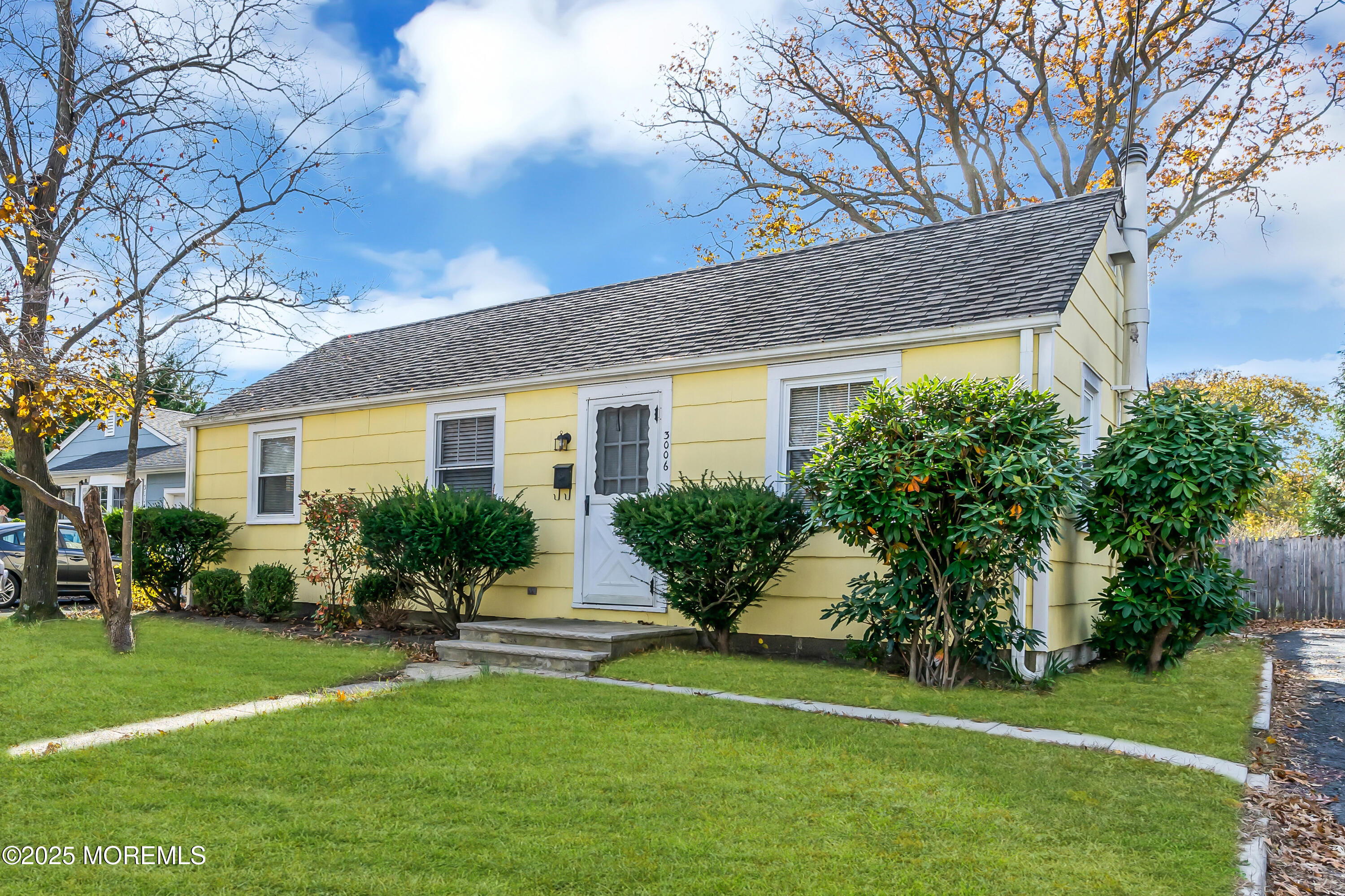 a front view of house with yard and outdoor seating