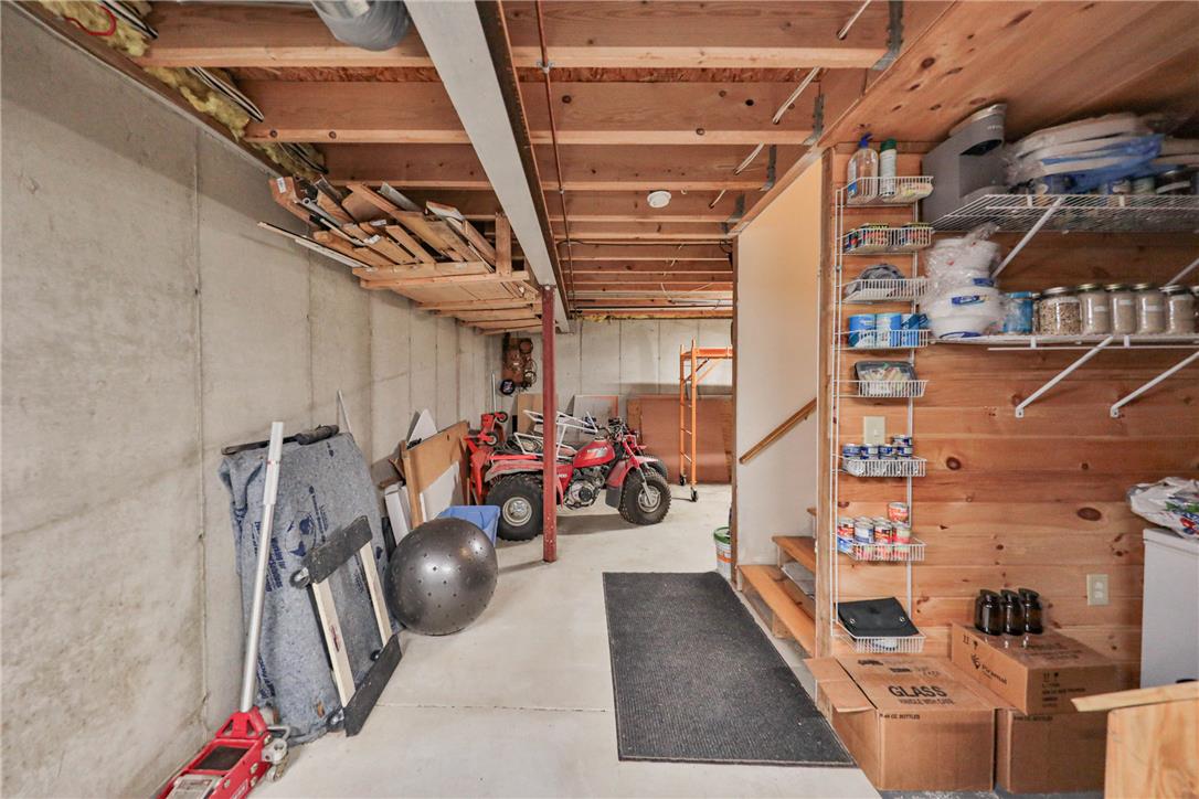 63 Long Road Lenhartsville, PA 19534 - Photo 94 of 100 Concrete floors and exposed wood ceilings define this functional lower level utility space.