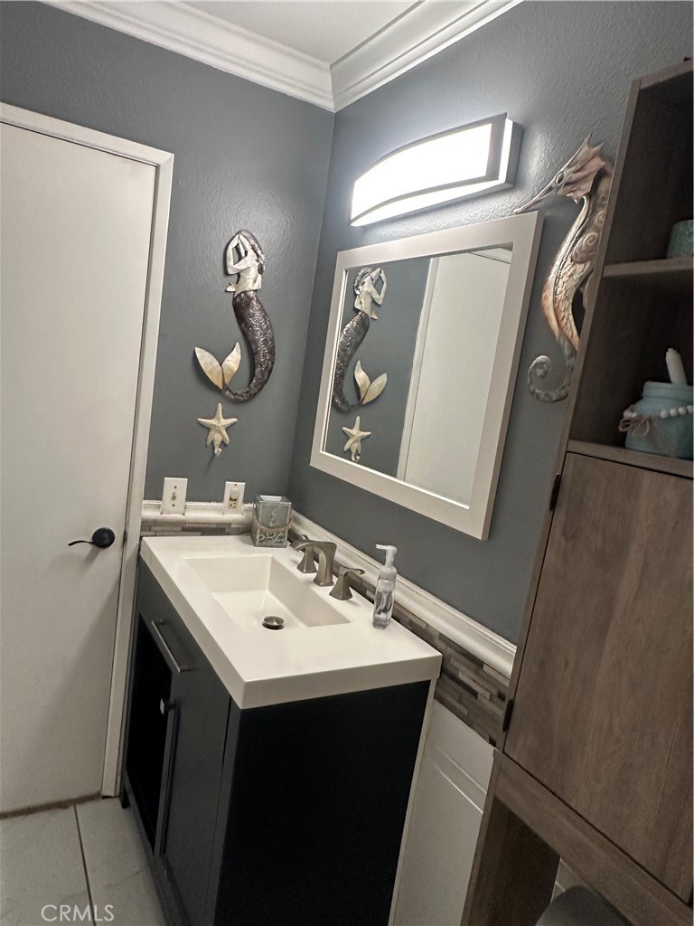 18223 Soledad Canyon Road, Unit 45 Canyon Country, CA 91387 - Photo 4 of 24 a bathroom with a sink vanity and a mirror