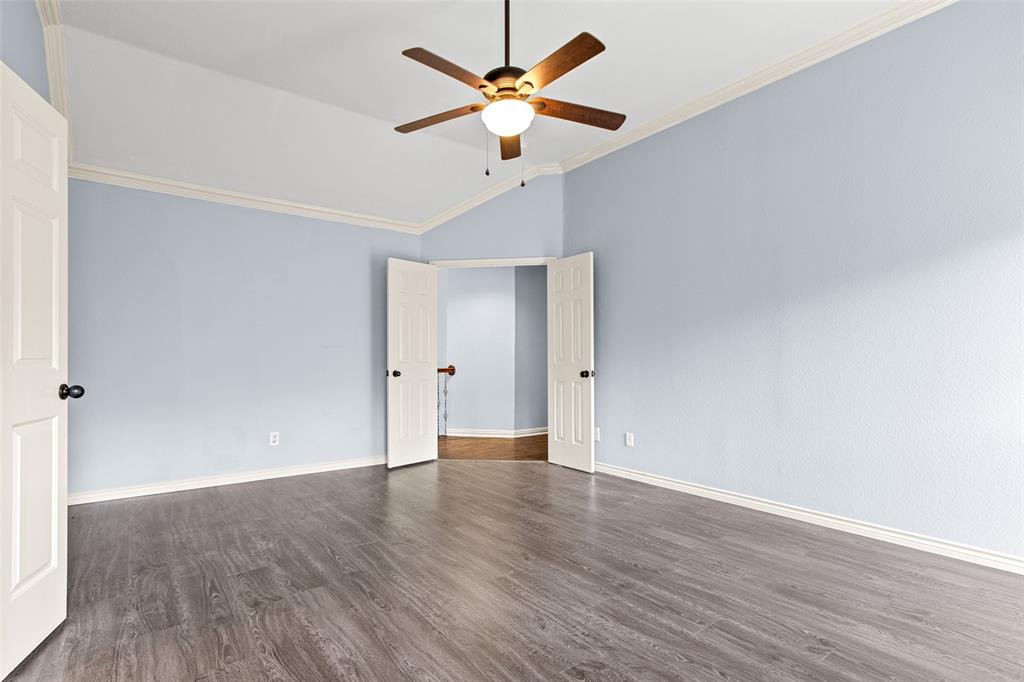 2604 Ridgewood Drive Plano, TX 75074 - Photo 20 of 35 Spacious room with vaulted ceilings and wood-finish flooring