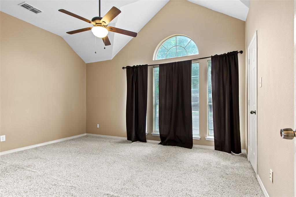 2604 Ridgewood Drive Plano, TX 75074 - Photo 26 of 35 Spacious room featuring vaulted ceilings, a ceiling fan with integrated lighting, and carpet flooring