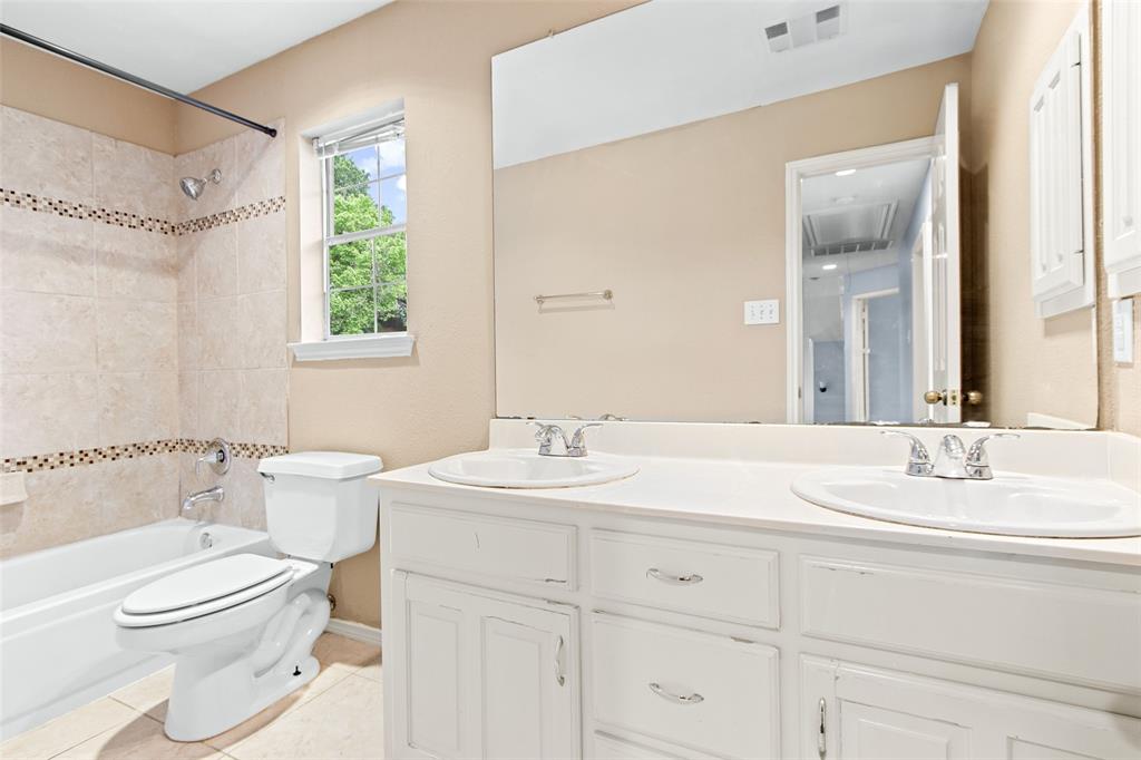 2604 Ridgewood Drive Plano, TX 75074 - Photo 27 of 35 Dual vanity with integrated sinks and white cabinetry