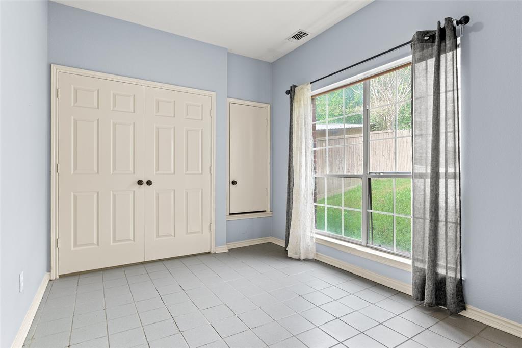 2604 Ridgewood Drive Plano, TX 75074 - Photo 30 of 35 Room with light blue walls, ceramic tile flooring, and a large window featuring grid panes