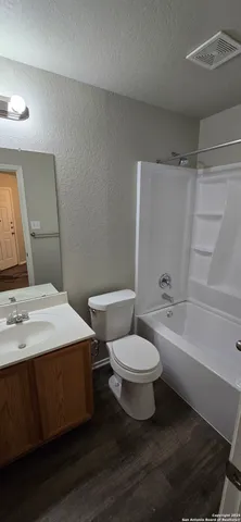 a bathroom with a sink toilet and a bathtub