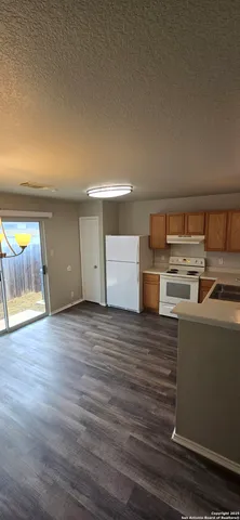 a room with wooden floor and window