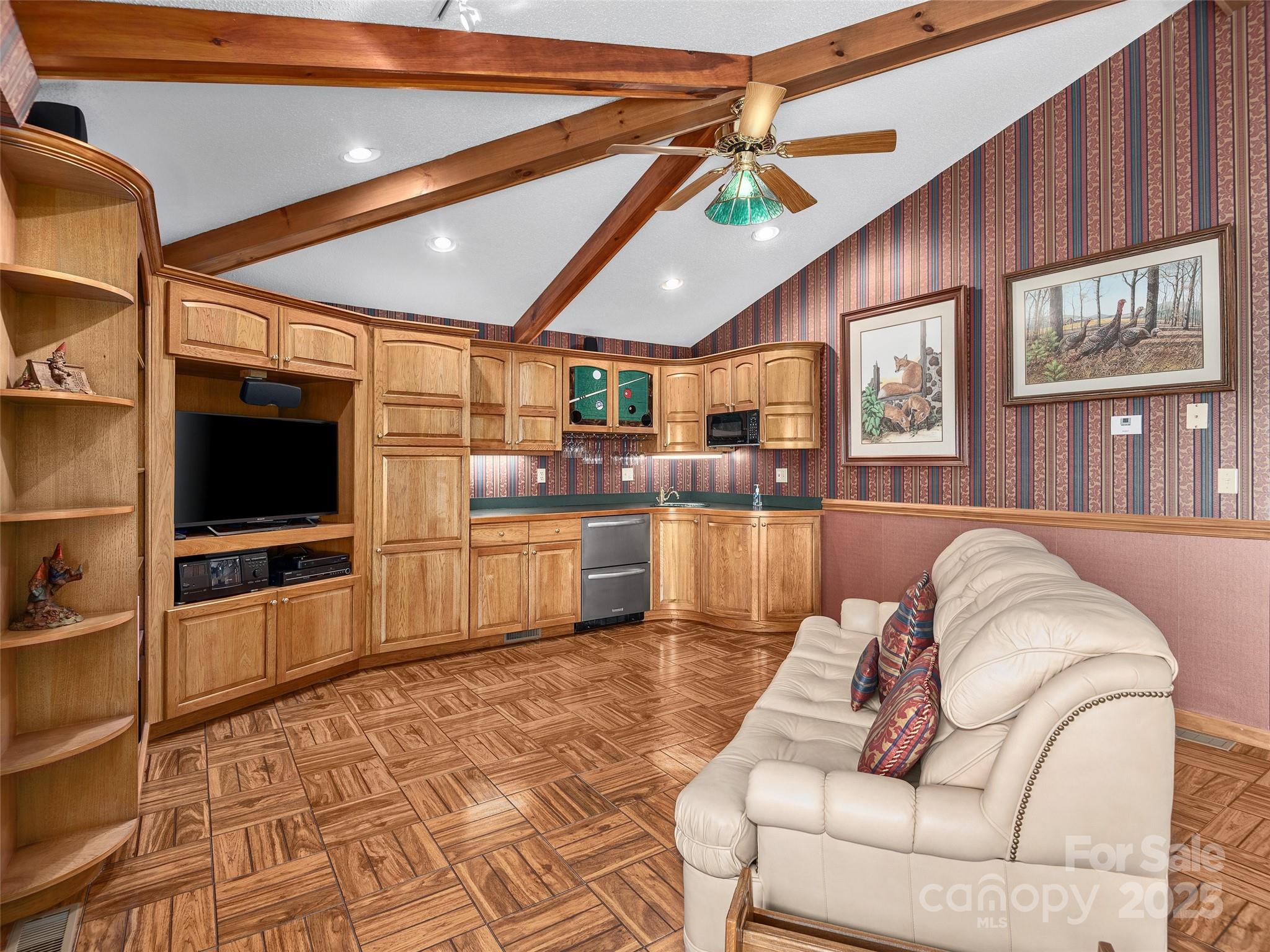 1300 Randy Drive Hendersonville, NC 28791 - Photo 18 of 48 a living room with furniture a flat screen tv and kitchen view