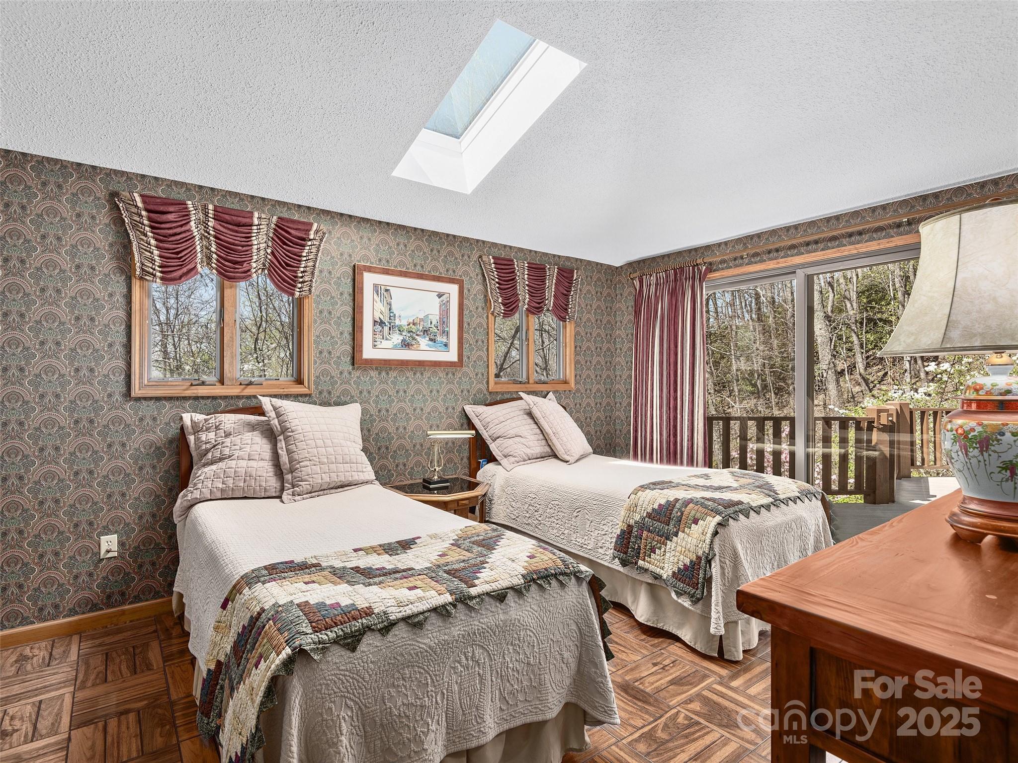 1300 Randy Drive Hendersonville, NC 28791 - Photo 20 of 48 a bedroom with two beds and a large window