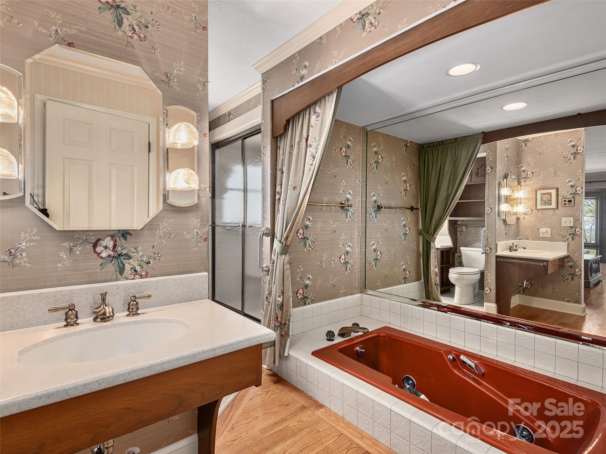 1300 Randy Drive Hendersonville, NC 28791 - Photo 23 of 48 a bathroom with a tub sink and mirror