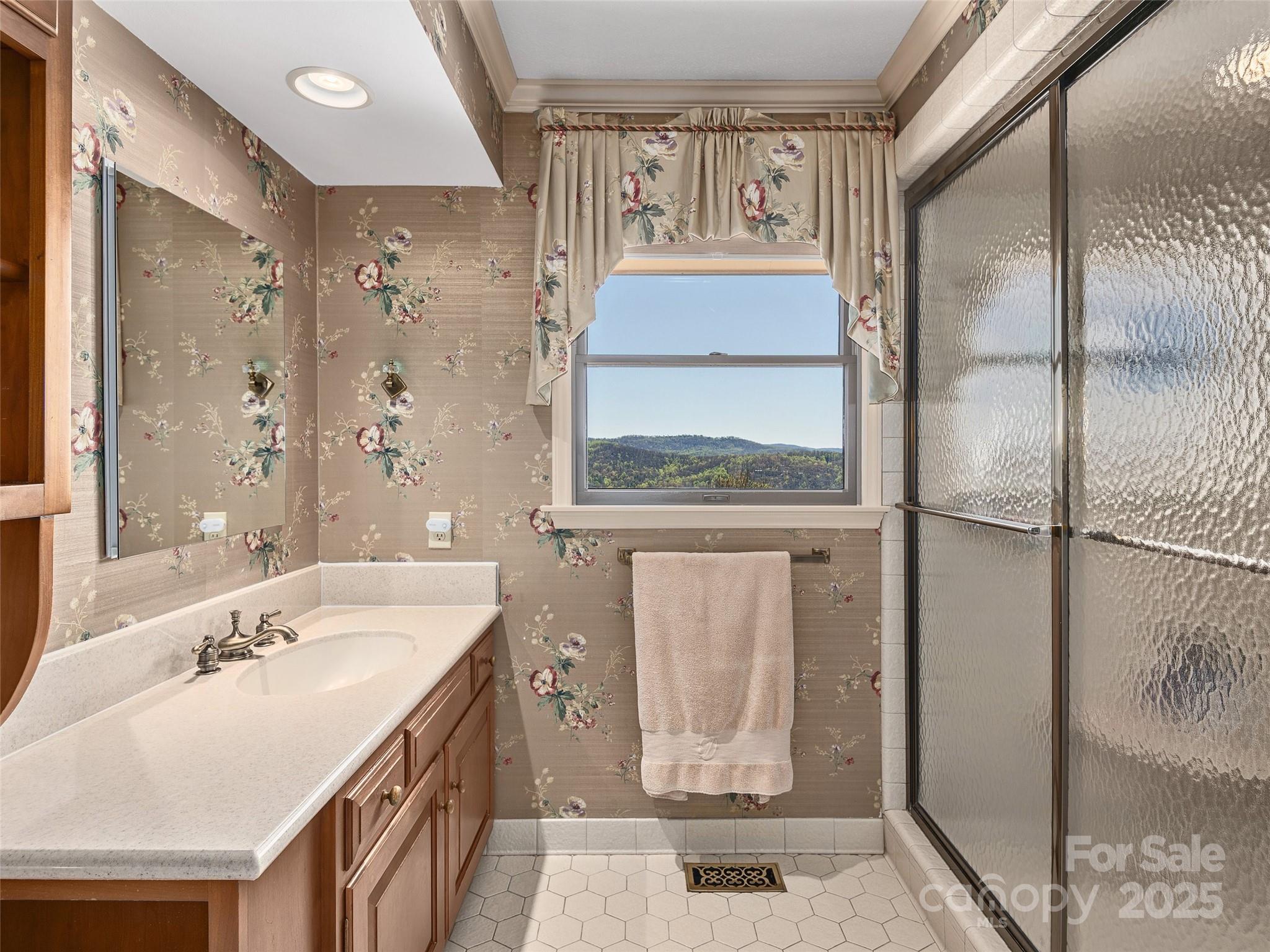 1300 Randy Drive Hendersonville, NC 28791 - Photo 24 of 48 a bathroom with a double vanity sink mirror and shower
