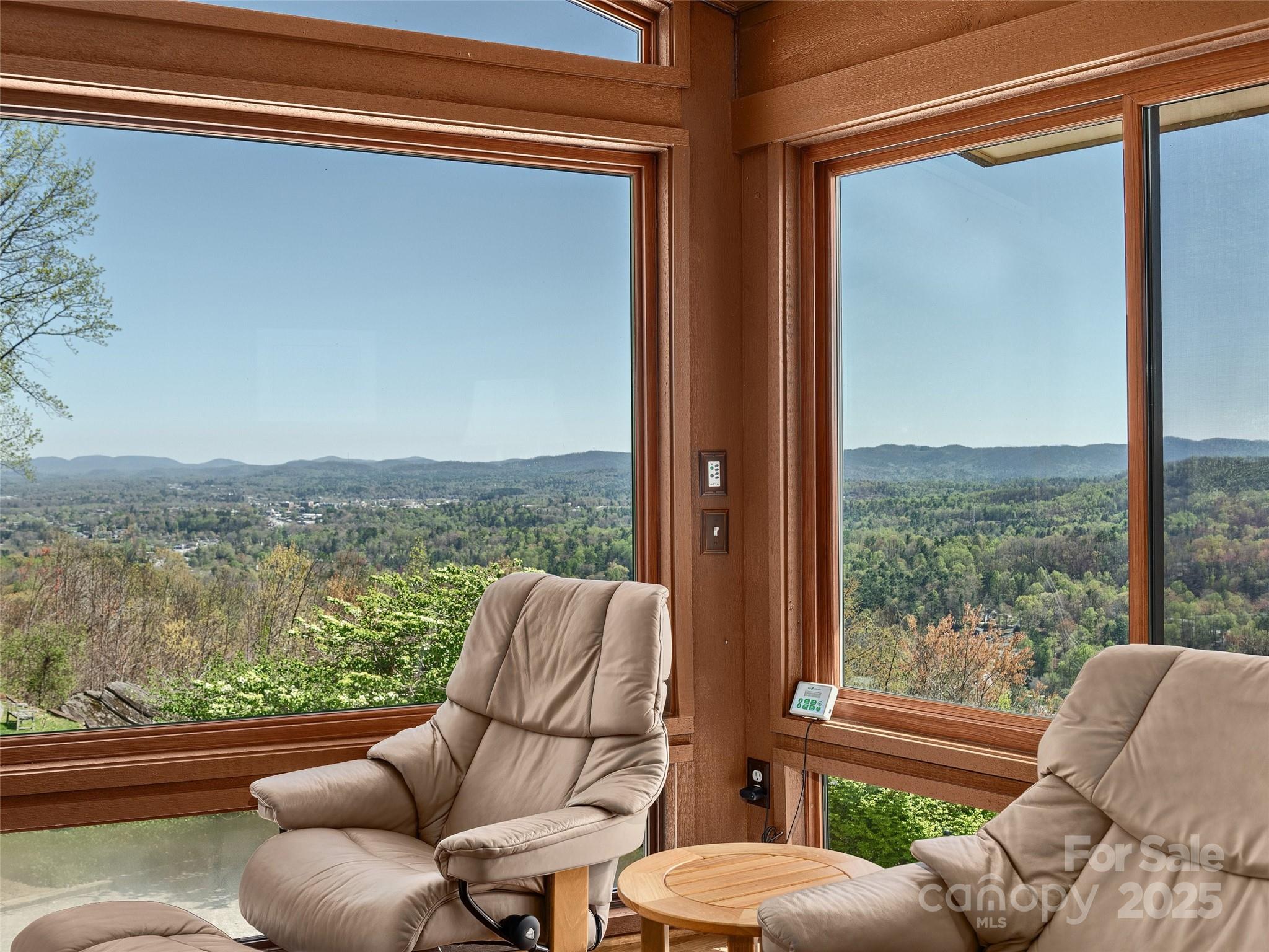 1300 Randy Drive Hendersonville, NC 28791 - Photo 26 of 48 a balcony with furniture and a floor to ceiling window