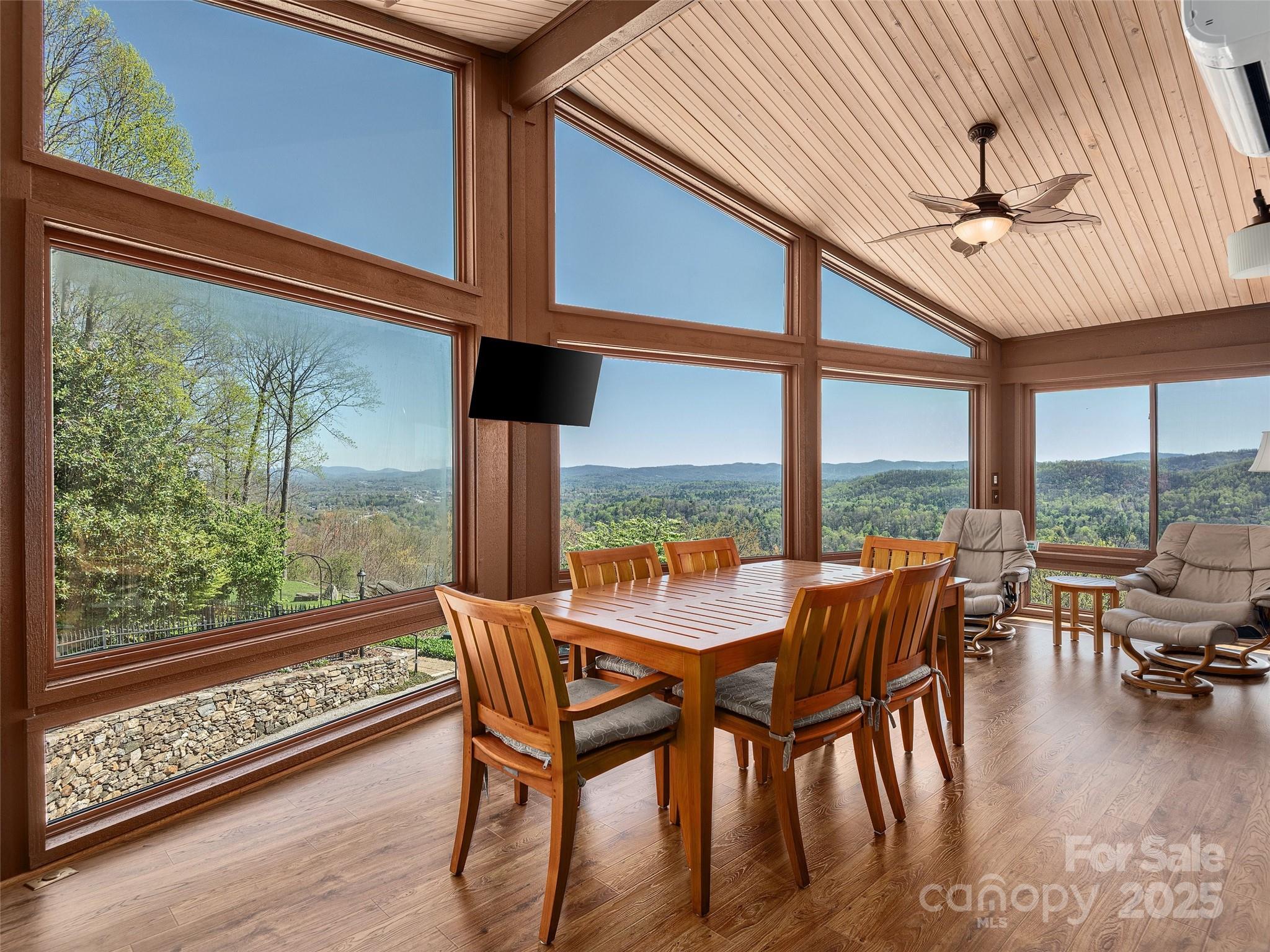 1300 Randy Drive Hendersonville, NC 28791 - Photo 27 of 48 a dining room with furniture and a floor to ceiling window