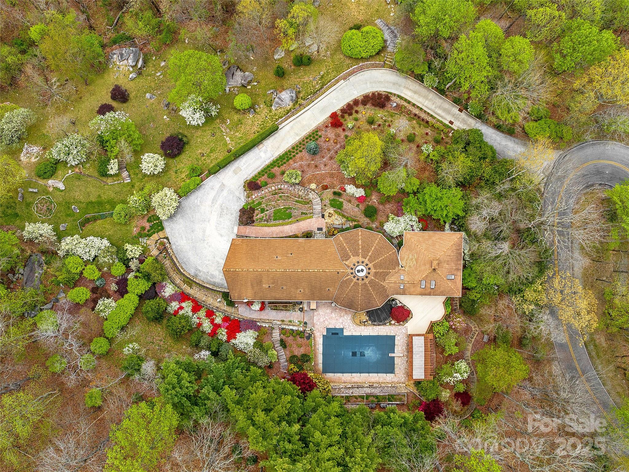 1300 Randy Drive Hendersonville, NC 28791 - Photo 43 of 48 an aerial view of a house with a pool and large trees