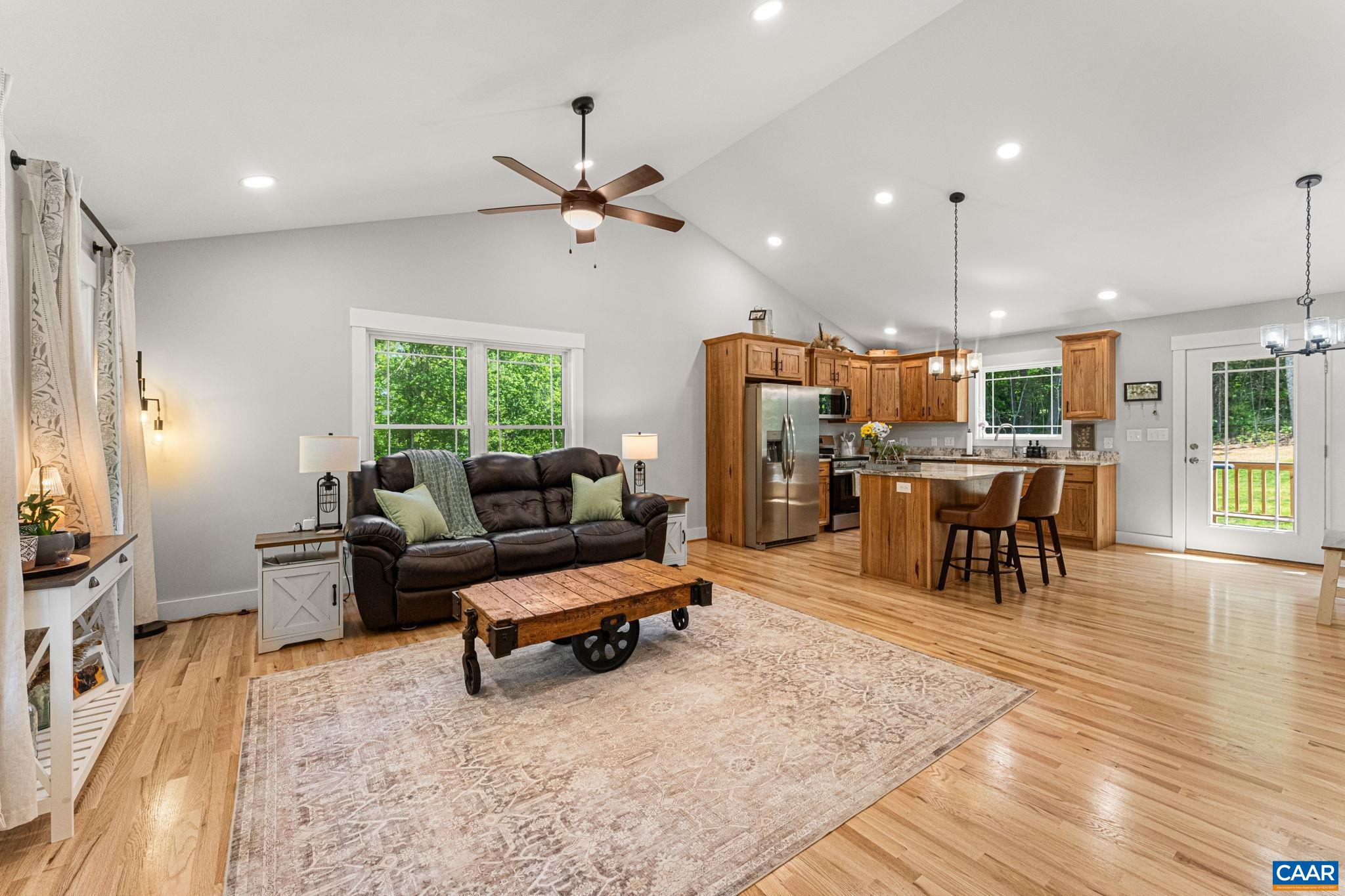230 Fox Hollow Road Ruckersville, VA 22968 - Photo 8 of 42 a living room with furniture and a wooden floor