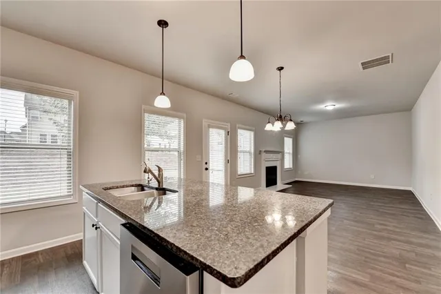 a kitchen with sink and window