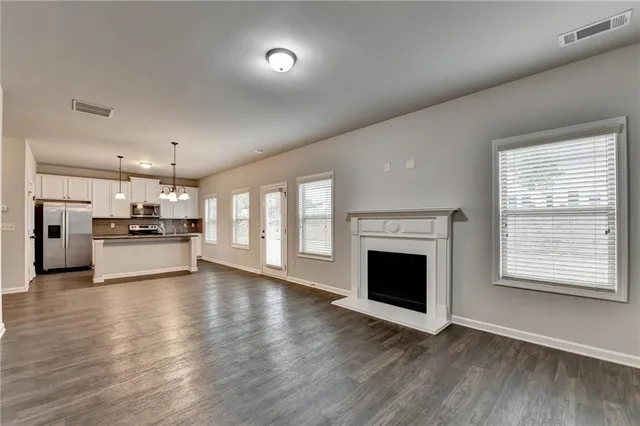a view of kitchen with livingroom and fireplace