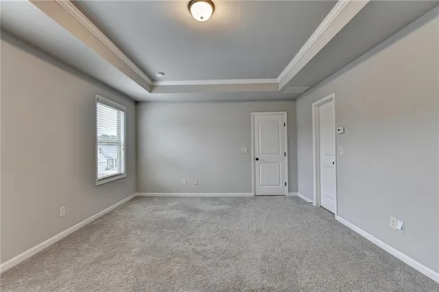 a view of an empty room with windows