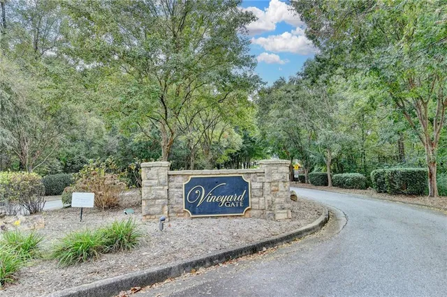 a sign that is sitting on a wooden bench