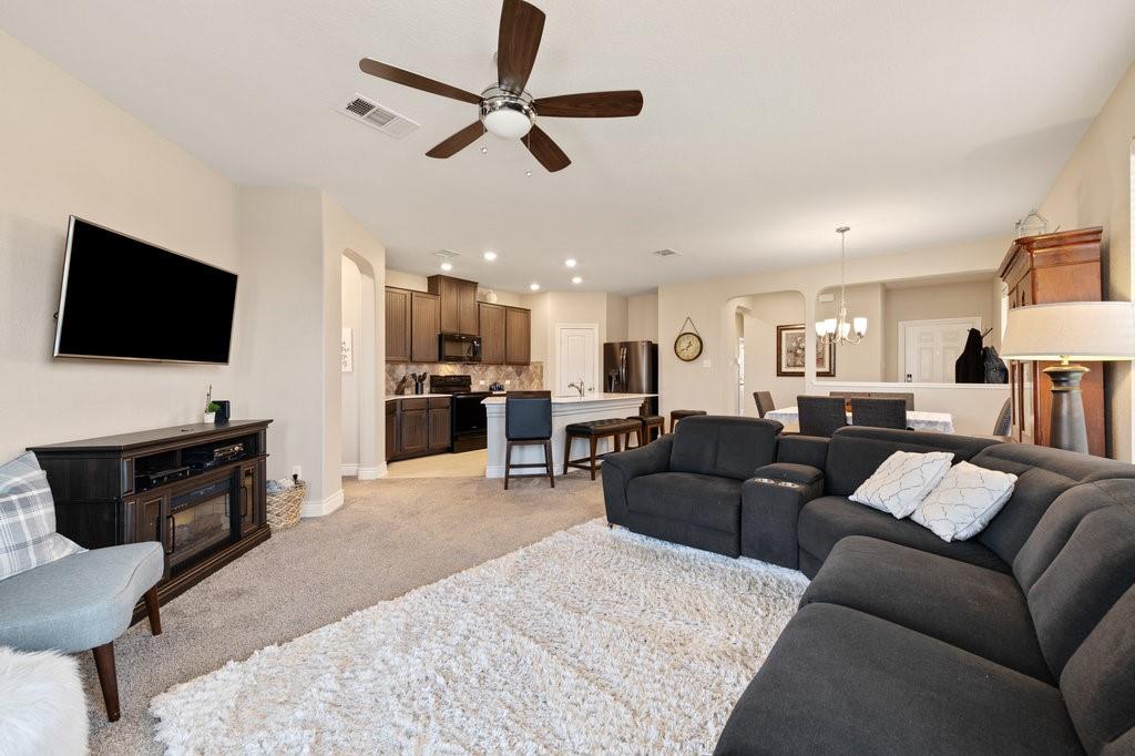 2471 Sunrise Road, Unit 16 Round Rock, TX 78664 - Photo 15 of 28 a living room with furniture and a flat screen tv