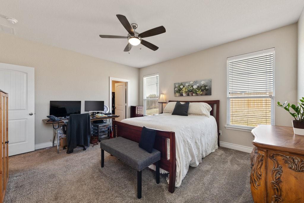 2471 Sunrise Road, Unit 16 Round Rock, TX 78664 - Photo 16 of 28 a bedroom with a bed and a flat screen tv