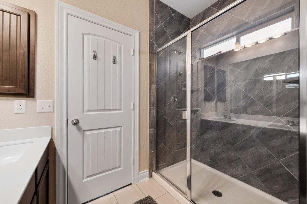 2471 Sunrise Road, Unit 16 Round Rock, TX 78664 - Photo 19 of 28 a bathroom with a shower and a sink
