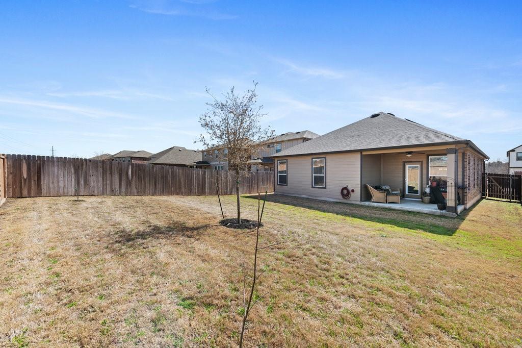 2471 Sunrise Road, Unit 16 Round Rock, TX 78664 - Photo 24 of 28 a view of a house with a yard