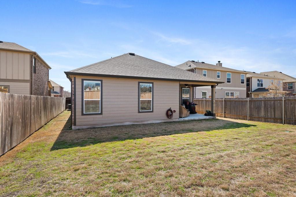 2471 Sunrise Road, Unit 16 Round Rock, TX 78664 - Photo 26 of 28 a view of a house with wooden fence