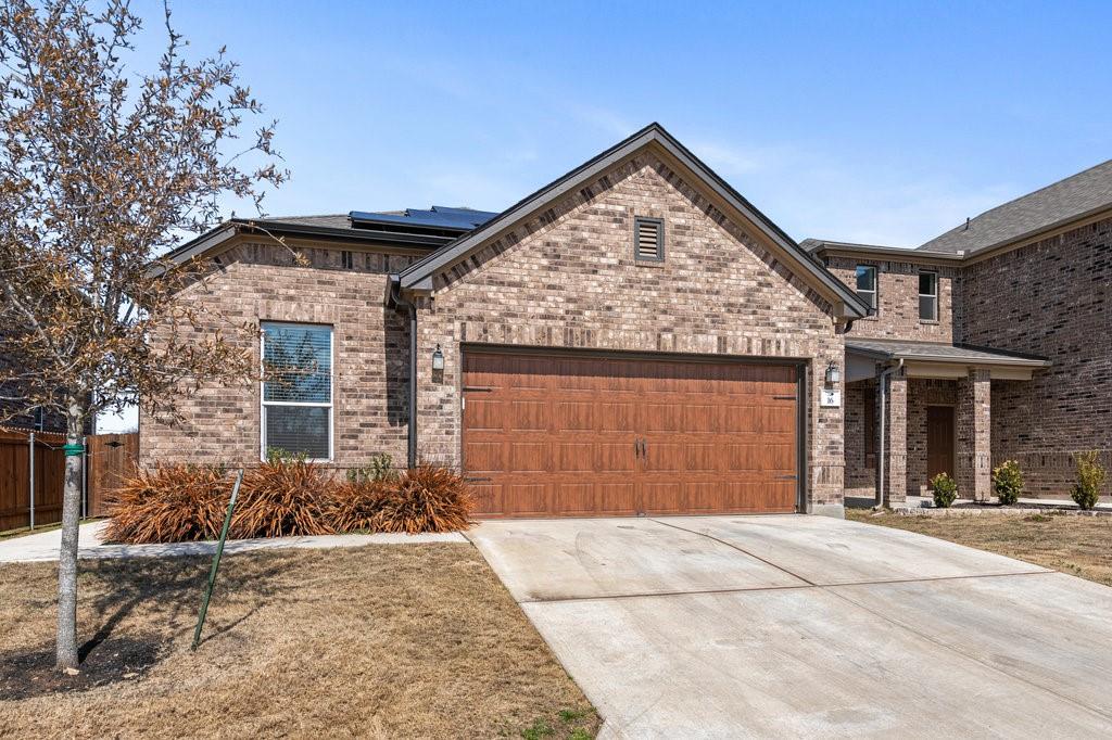 2471 Sunrise Road, Unit 16 Round Rock, TX 78664 - Photo 3 of 28 front view of a house with a yard