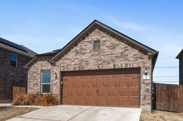a view of house with garage