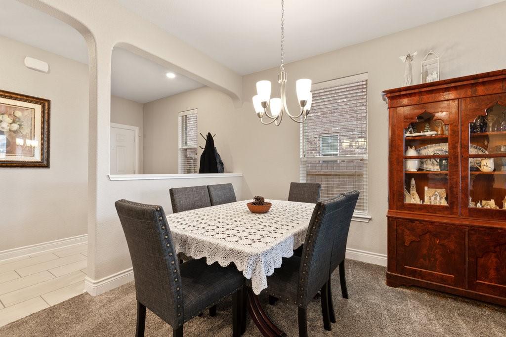 2471 Sunrise Road, Unit 16 Round Rock, TX 78664 - Photo 10 of 28 a view of a dining room with furniture window and wooden floor