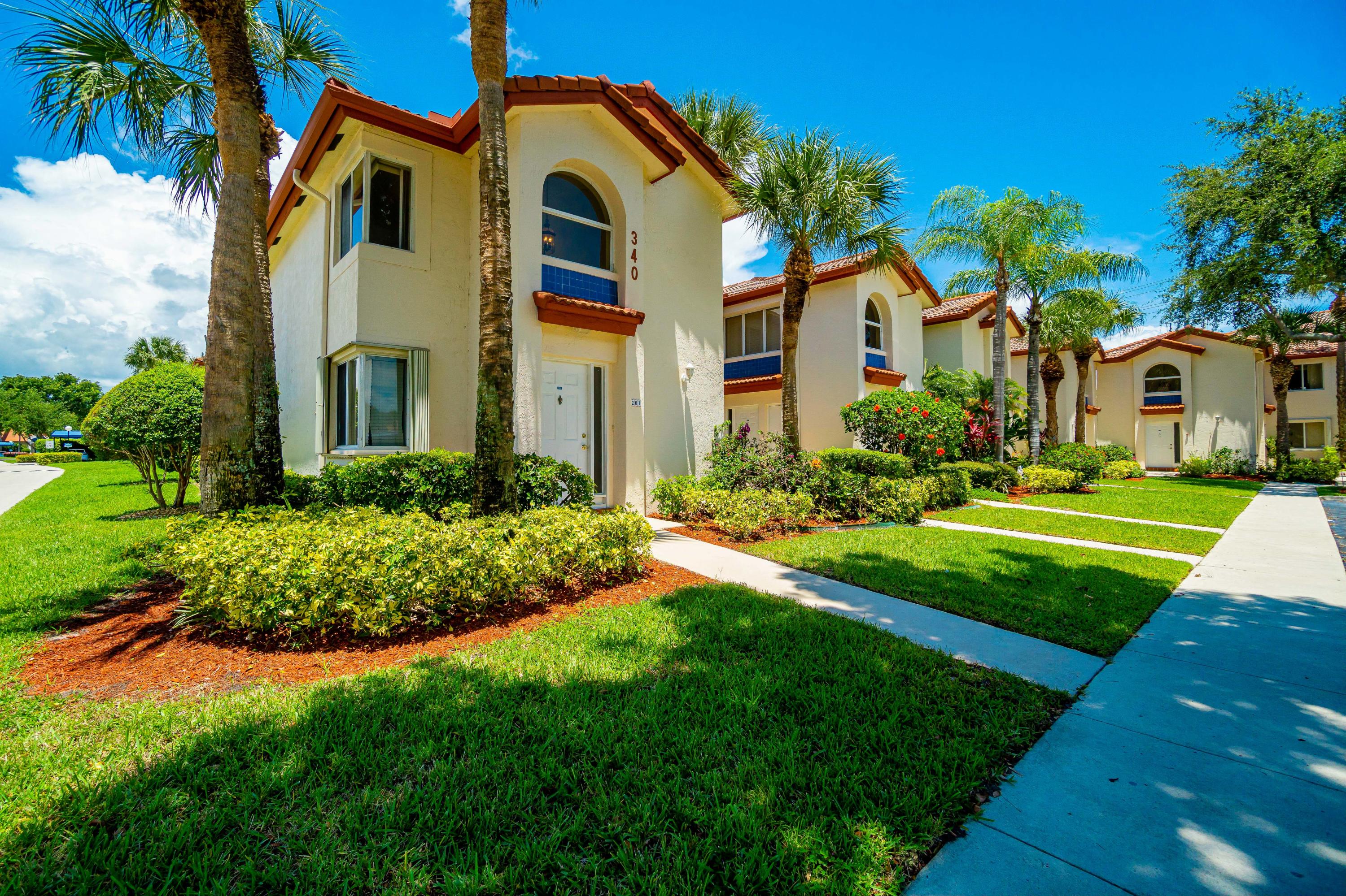 340 Northwest 67th Street, Unit 201 Boca Raton, FL 33487 - Photo 2 of 46 Front view