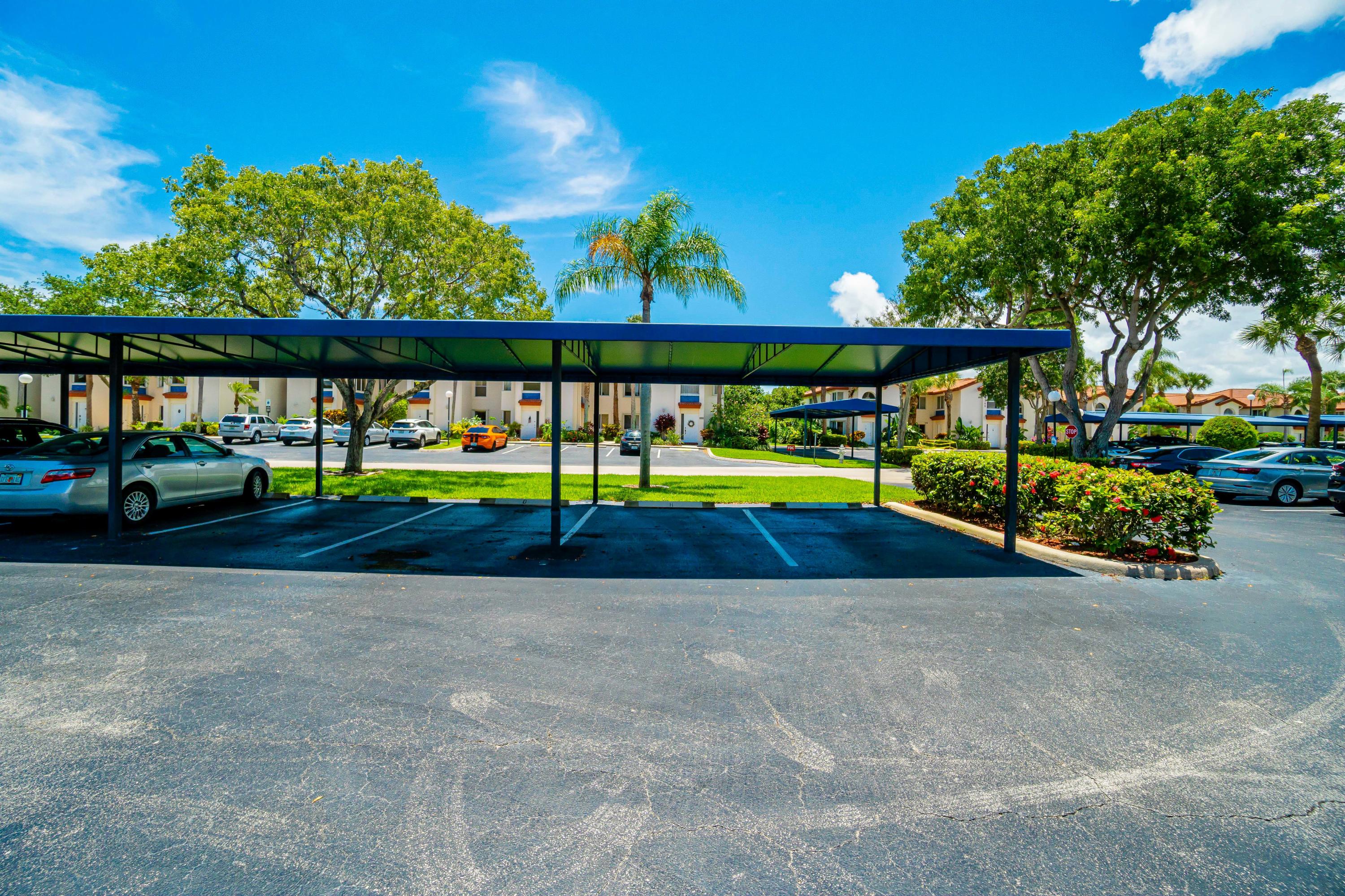 340 Northwest 67th Street, Unit 201 Boca Raton, FL 33487 - Photo 34 of 46 Covered parking