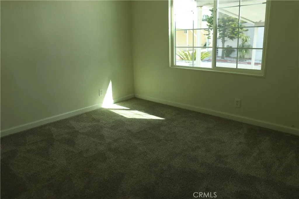 1855 East Riverside Drive, Unit 48 Ontario, CA 91761 - Photo 14 of 20 a view of room with window