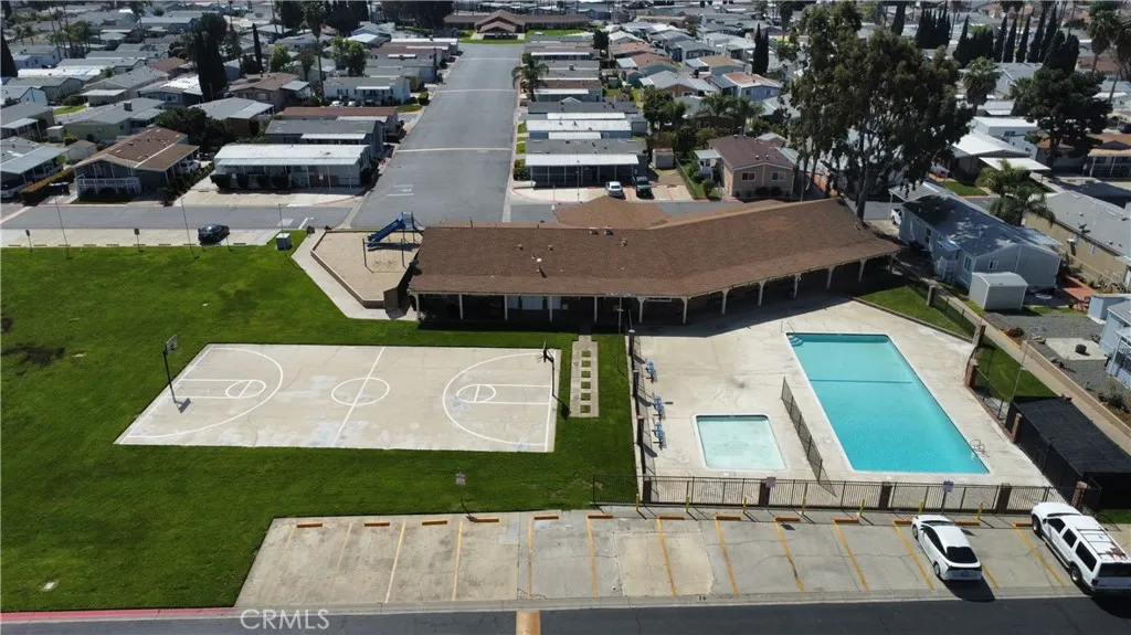 1855 East Riverside Drive, Unit 48 Ontario, CA 91761 - Photo 18 of 20 an aerial view of a house with a yard