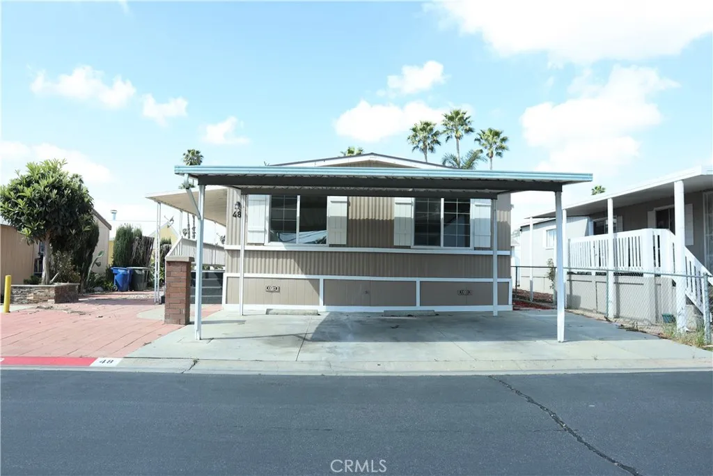 1855 East Riverside Drive, Unit 48 Ontario, CA 91761 - Photo 2 of 20 a view of a house with a outdoor space