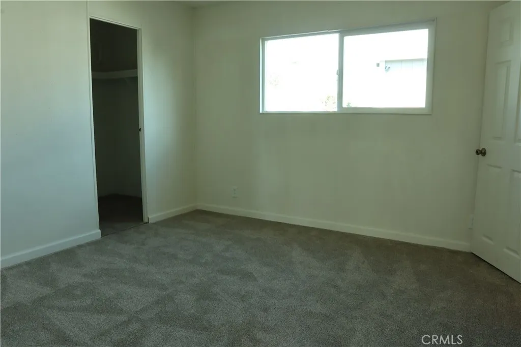 1855 East Riverside Drive, Unit 48 Ontario, CA 91761 - Photo 10 of 20 an empty room with a window