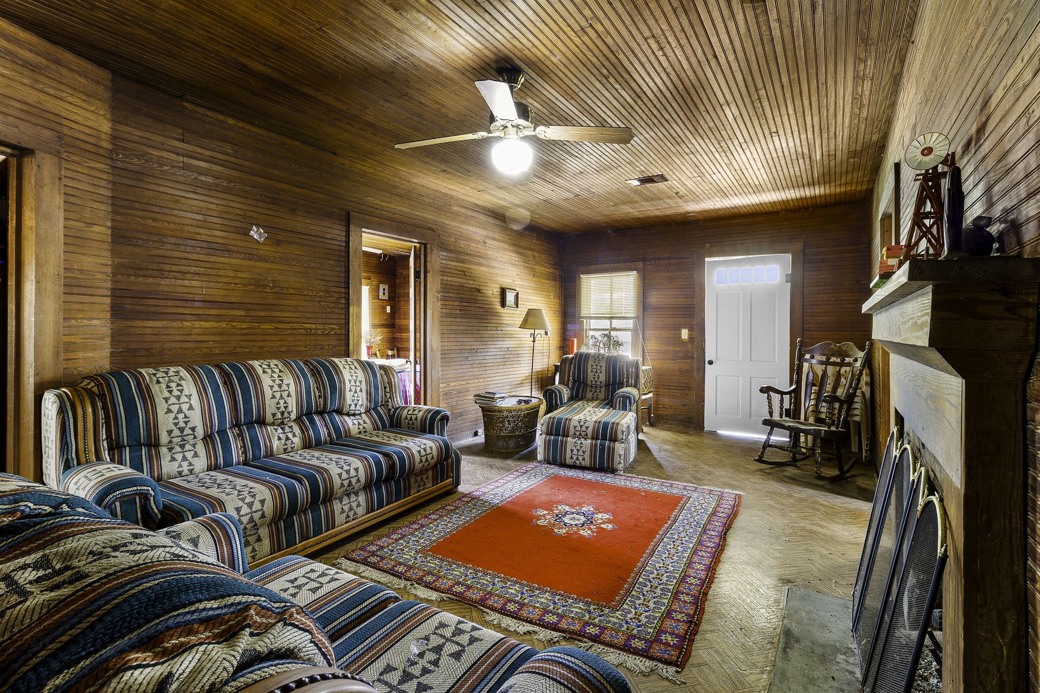 2 Triple Creek Loop Livingston, TX 77351 - Photo 7 of 49 a living room with furniture a rug and a chandelier