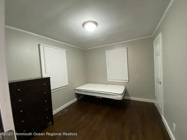 a room with a mirror and a fan